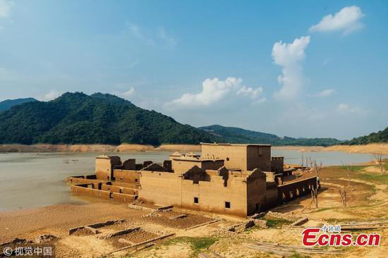 Village ruins rise from reservoir after 26 years